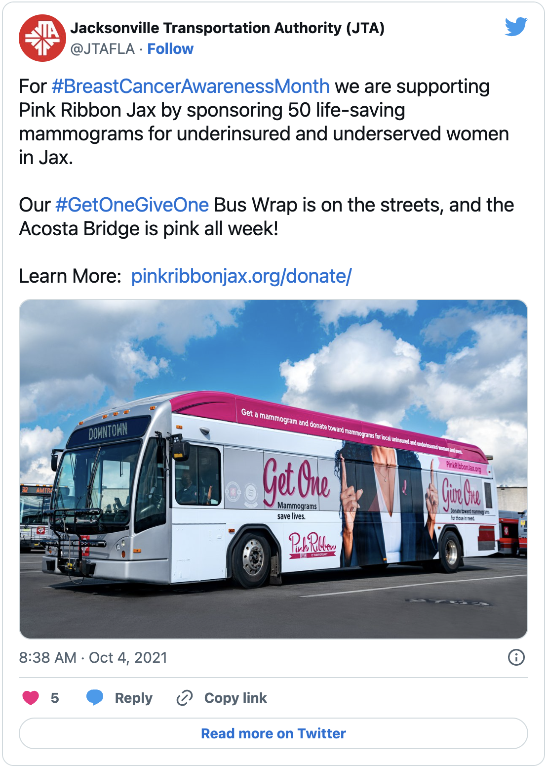 A tweet about JTA's partnership with Pink Ribbon Jax that reads For  Breast Cancer Awareness Month we are supporting Pink Ribbon Jax by sponsoring 50 life-saving mammograms for underinsured and underserved women in Jax. Our Get One Give One Bus Wrap is on the streets, and the Acosta Bridge is pink all week! Learn More at https://pinkribbonjax.org/donate/